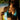 Woman holding and using Gfloss hands-free dental floss at the beach
