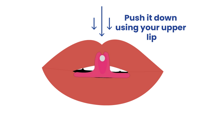 Press the tip with your lip to pop it out.