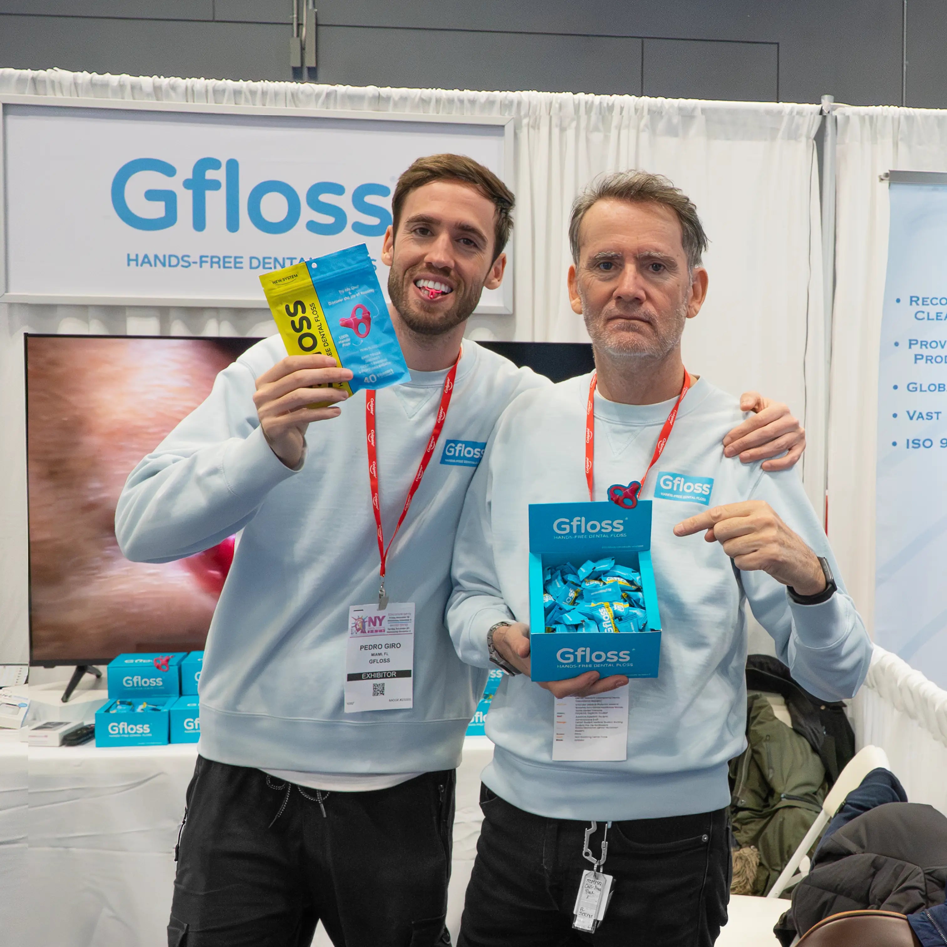 Father and son founders presenting Gfloss hands-free dental floss at the Greater New York Dental Meeting.